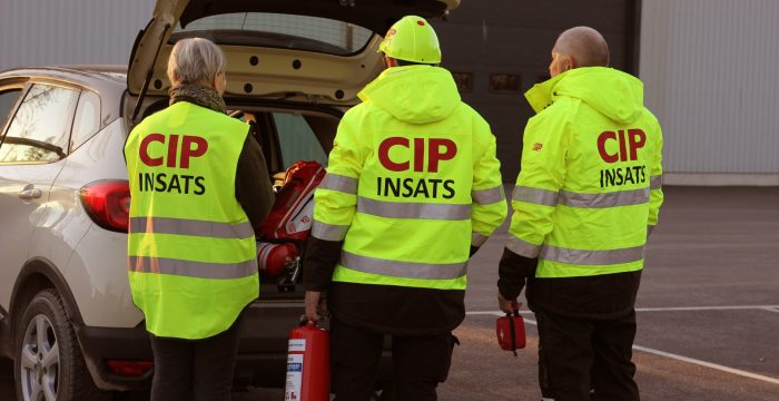 Tre CIP med reflexväst